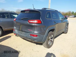 2014 Jeep Cherokee Trailhawk with VIN 1C4PJMBS6EW278987, listed as a IAAI auction lot 41789868 with 136,696 mi miles. Bid and sale history available at carsss.com. Image 4.