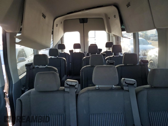 2018 Ford Transit Passenger XL with VIN 1FBVU4XG3JKA28907, listed as a Copart auction lot 69424444 with 61,411 mi miles and Salvage Title. Bid and sale history available at DreamBid. Image 10.