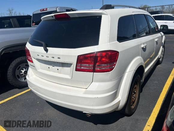 2017 Dodge Journey SE z VIN 3C4PDCAB7HT676612, wystawiony jako IAAI lot #42024212 z przebiegiem 87 781 mil mil oraz . Historia ofert i sprzedaży dostępna na DreamBid. Obrazek 1.