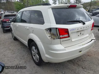 2014 Dodge Journey SE with VIN 3C4PDCABXET135338, listed as a IAAI auction lot 41950088 with 209,944 mi miles. Bid and sale history available at carsss.com. Image 3.