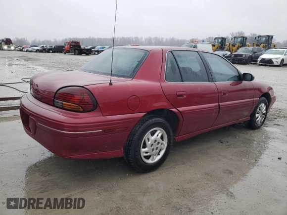 1997 Pontiac Grand Am SE z VIN 1G2NE52T4VC747929, wystawiony jako Copart lot #43959975 z przebiegiem 142 673 mil mil oraz Szkoda całkowita • Salvage title. Historia ofert i sprzedaży dostępna na DreamBid. Obrazek 3.