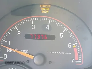2005 Pontiac Grand Am SE with VIN 1G2NE52E25M101462, listed as a IAAI auction lot 41743136 with 77,376 mi miles. Bid and sale history available at carsss.com. Image 16.