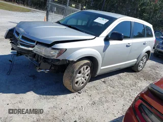 2014 Dodge Journey American Value Pkg with VIN 3C4PDCAB7ET259230, listed as a IAAI auction lot 41675179 with 151,386 mi miles. Bid and sale history available at carsss.com. Image 2.