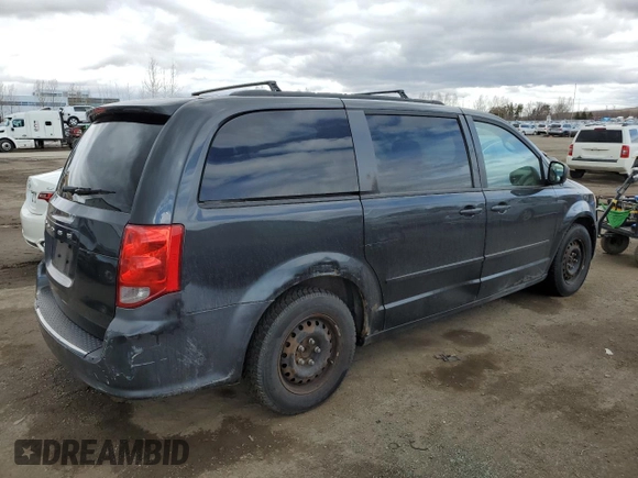 2012 Dodge Grand Caravan SE with VIN 2C4RDGBG5CR397651, listed as a Copart auction lot 52878905 with 248,103 mi miles and Clean Title. Bid and sale history available at DreamBid. Image 3.