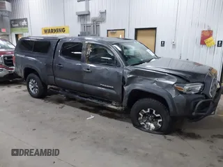 2016 Toyota Tacoma SR5 with VIN 3TMDZ5BNXGM009423, listed as a IAAI auction lot 41008068 with 107,426 mi miles and . Bid and sale history available at DreamBid. Image 1.