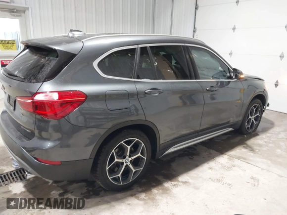2018 BMW X1 xDrive28i with VIN WBXHT3C38J5L34625, listed as a IAAI auction lot 41133876 with 60,986 mi miles and . Bid and sale history available at DreamBid. Image 4.