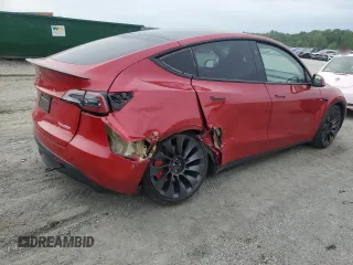 2023 Tesla Model Y Performance z VIN 7SAYGDEF2PF857843, wystawiony jako Copart lot #57324255 z przebiegiem 22 618 mil mil oraz Szkoda całkowita • Salvage title. Historia ofert i sprzedaży dostępna na DreamBid. Obrazek 3.