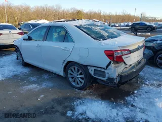 2014 Toyota Camry Hybrid LE with VIN 4T1BD1FK7EU114181, listed as a IAAI auction lot 41294936 with 115,986 mi miles. Bid and sale history available at carsss.com. Image 3.