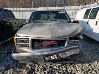 1999 GMC Yukon with VIN 1GKEK13R3XJ785249, listed as a Copart auction lot 42825185 with 351,225 mi miles and Salvage Title. Bid and sale history available at carsss.com. Image 5.