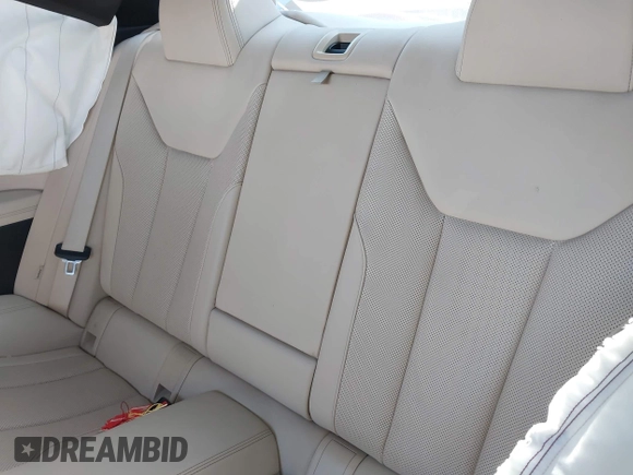 2022 BMW 4 Series 430i xDrive with VIN WBA73AP03NCH61029, listed as a IAAI auction lot 42327779 with 104,860 mi miles and . Bid and sale history available at DreamBid. Image 8.
