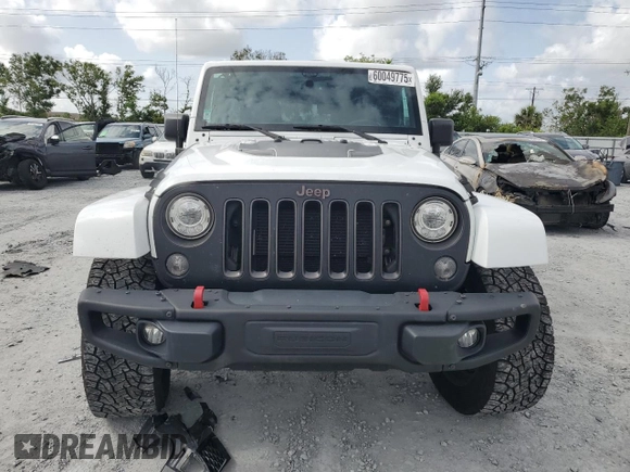 2017 Jeep Wrangler Unlimited Rubicon z VIN 1C4HJWFG6HL692928, wystawiony jako Copart lot #60049775 z przebiegiem 145 033 mil mil oraz Nie do naprawy • Non repairable. Historia ofert i sprzedaży dostępna na DreamBid. Obrazek 5.