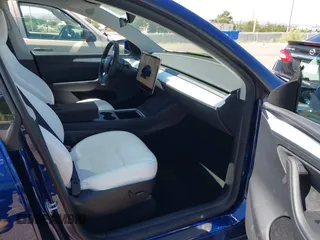2024 Tesla Model Y Long Range with VIN 7SAYGDEE6RA242980, listed as a IAAI auction lot 40121685 with 9,126 mi miles and . Bid and sale history available at DreamBid. Image 5.