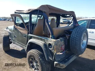 1998 Jeep Wrangler SE with VIN 1J4FY29P6WP709203, listed as a IAAI auction lot 41962877 with 1 mi miles. Bid and sale history available at carsss.com. Image 16.
