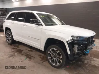 2022 Jeep Grand Cherokee Overland z VIN 1C4RJYD64N8764573, wystawiony jako IAAI lot #41101052 z przebiegiem 64 091 mil mil oraz . Historia ofert i sprzedaży dostępna na DreamBid. Obrazek 1.
