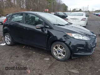 2015 Ford Fiesta SE with VIN 3FADP4EJ9FM175123, listed as a IAAI auction lot 41948452 with 130,801 mi miles. Bid and sale history available at carsss.com. Image 1.