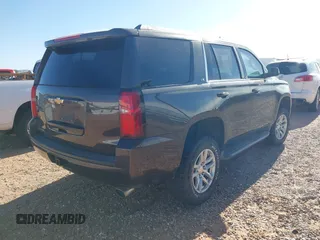 2015 Chevrolet Tahoe LS with VIN 1GNSCAKC9FR122896, listed as a IAAI auction lot 42239812 with 164,888 mi miles and . Bid and sale history available at DreamBid. Image 4.