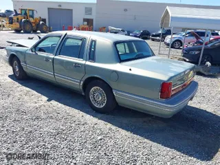 1994 Lincoln Town Car Signature with VIN 1LNLM82W5RY616904, listed as a IAAI auction lot 41811628 with 163,653 mi miles. Bid and sale history available at carsss.com. Image 3.