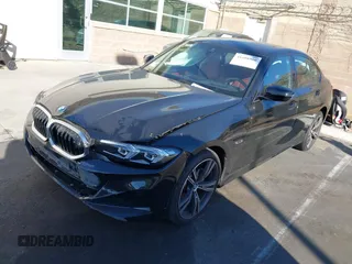 2023 BMW 3 Series 330e with VIN 3MW39FF08P8D57694, listed as a IAAI auction lot 41608900 with 19,483 mi miles. Bid and sale history available at carsss.com. Image 2.