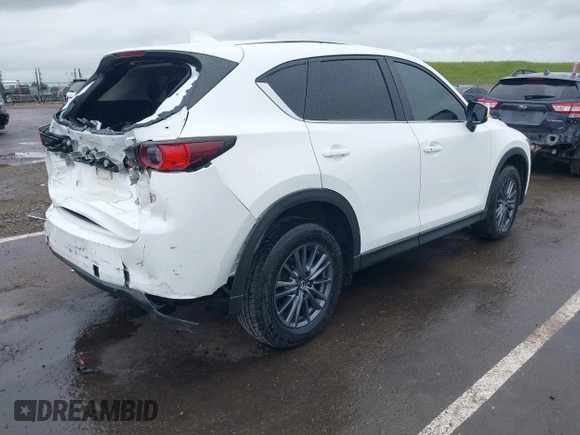 2020 Mazda CX-5 Touring with VIN JM3KFACM0L0738615, listed as a IAAI auction lot 41923923 with 52,599 mi miles. Bid and sale history available at carsss.com. Image 4.