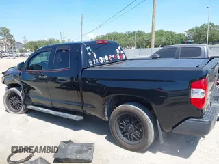 2019 Toyota Tundra SR with VIN 5TFUY5F13KX852912, listed as a IAAI auction lot 42327399 with 124,193 mi miles and . Bid and sale history available at DreamBid. Image 14.