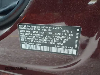 2013 Volkswagen Passat Wolfsburg Edition with VIN 1VWAP7A38DC136413, listed as a IAAI auction lot 42022470 with 265,221 mi miles. Bid and sale history available at carsss.com. Image 9.