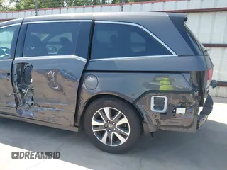 2014 Honda Odyssey Touring with VIN 5FNRL5H99EB075979, listed as a IAAI auction lot 42520154 with 99,314 mi miles and . Bid and sale history available at DreamBid. Image 18.