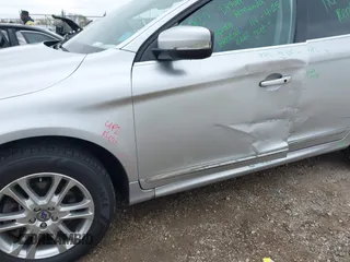 2015 Volvo XC60 T5 Drive-E Premier z VIN YV440MDB9F2613538, wystawiony jako IAAI lot #42183886 z przebiegiem 115 768 mil mil oraz . Historia ofert i sprzedaży dostępna na DreamBid. Obrazek 6.