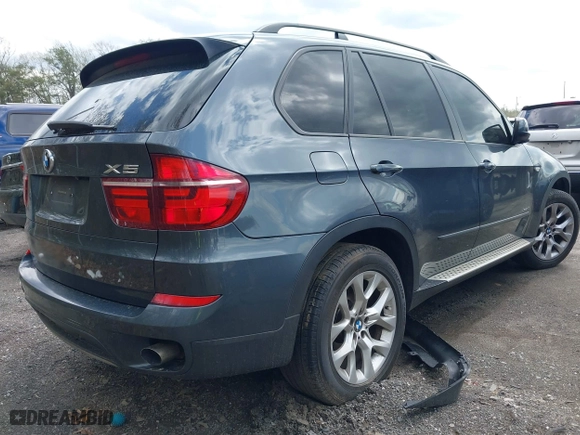 2011 BMW X5 35i with VIN 5UXZV4C56BL406632, listed as a IAAI auction lot 41981590 with 168,534 mi miles. Bid and sale history available at carsss.com. Image 4.
