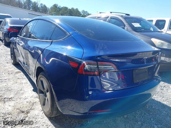 2023 Tesla Model 3 with VIN 5YJ3E1EA8PF671465, listed as a IAAI auction lot 41599200 with 21,859 mi miles. Bid and sale history available at carsss.com. Image 3.
