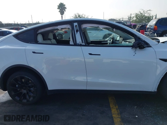2023 Tesla Model Y Long Range with VIN 7SAYGDEE3PF900030, listed as a IAAI auction lot 41147192 with 13,903 mi miles and . Bid and sale history available at DreamBid. Image 12.