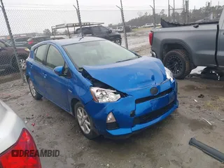 2014 Toyota Prius One z VIN JTDKDTB34E1571983, wystawiony jako IAAI lot #41760657 z przebiegiem 237 497 mil mil oraz . Historia ofert i sprzedaży dostępna na DreamBid. Obrazek 13.