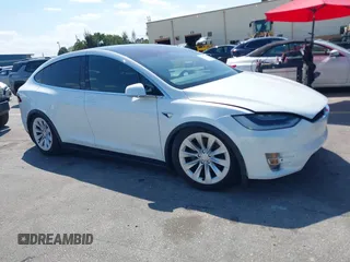 2017 Tesla Model X 90D with VIN 5YJXCBE23HF045670, listed as a IAAI auction lot 41793951 with 50,312 mi miles and . Bid and sale history available at DreamBid. Image 1.