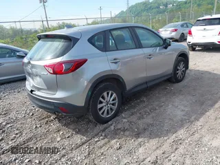 2014 Mazda CX-5 Sport with VIN JM3KE2BE9E0423737, listed as a IAAI auction lot 42222646 with 116,160 mi miles and . Bid and sale history available at DreamBid. Image 4.