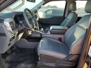 2023 Ford F-150 Lightning Pro with VIN 1FTVW1EL7PWG11261, listed as a Copart auction lot 64088925 with 3,288 mi miles and Salvage title. Bid and sale history available at DreamBid. Image 7.