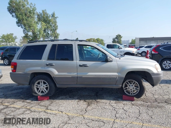 2004 Jeep Grand Cherokee Laredo with VIN 1J4GX48N24C334983, listed as a IAAI auction lot 42522088 with 169,793 mi miles and . Bid and sale history available at DreamBid. Image 13.