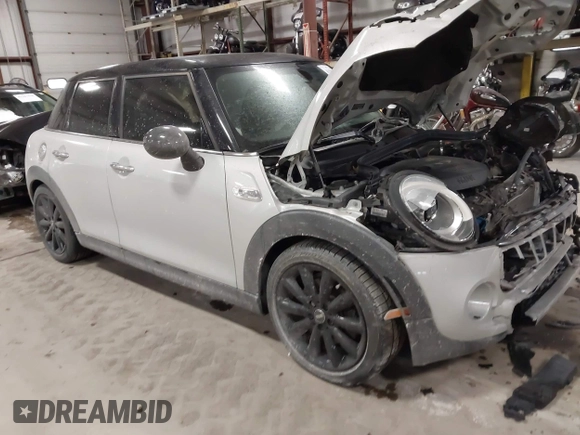 2015 MINI Hardtop 4 Door S with VIN WMWXU3C56F2B66449, listed as a IAAI auction lot 41296784 with 53,589 mi miles and . Bid and sale history available at DreamBid. Image 1.
