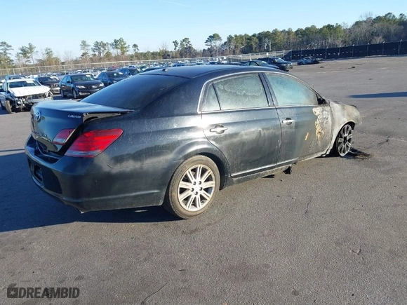 2009 Toyota Avalon XL with VIN 4T1BK36B99U339449, listed as a IAAI auction lot 41440848 with 437,984 mi miles. Bid and sale history available at carsss.com. Image 4.