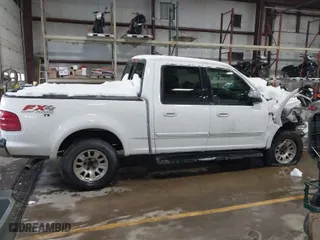 2001 Ford F-150 SuperCrew XLT with VIN 1FTRW08L41KF19093, listed as a IAAI auction lot 41419212 with 157,696 mi miles. Bid and sale history available at carsss.com. Image 13.