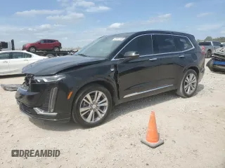 2023 Cadillac XT6 FWD Premium Luxury with VIN 1GYKPCRS6PZ127331, listed as a Copart auction lot 52951105 with 47,796 mi miles and Salvage Title. Bid and sale history available at carsss.com. Image 1.
