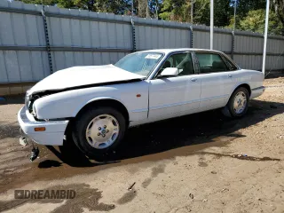1996 Jaguar XJ with VIN SAJHX1747TC767829, listed as a Copart auction lot 76677444 with Not provided miles and Salvage title. Bid and sale history available at DreamBid. Image 1.