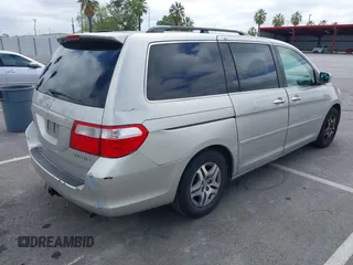 2005 Honda Odyssey EX-L with VIN 5FNRL38745B075486, listed as a IAAI auction lot 42080772 with 197,158 mi miles and . Bid and sale history available at DreamBid. Image 4.