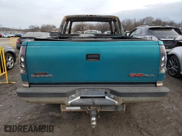 1995 GMC Sierra 1500 z VIN 2GTEK19K0S1570324, wystawiony jako Copart lot #43065205 z przebiegiem Nie podano mil oraz Szkody całkowita. Historia ofert i sprzedaży dostępna na DreamBid. Obrazek 6.