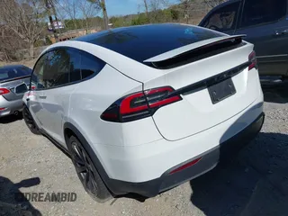 2023 Tesla Model X with VIN 7SAXCDE54PF430808, listed as a IAAI auction lot 41667924 with 21,100 mi miles and . Bid and sale history available at DreamBid. Image 3.
