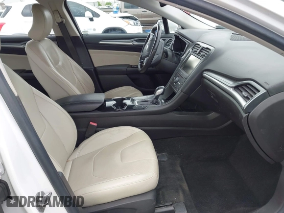 2016 Ford Fusion Titanium with VIN 3FA6P0SU5GR287017, listed as a IAAI auction lot 42316622 with 97,000 mi miles and . Bid and sale history available at DreamBid. Image 5.