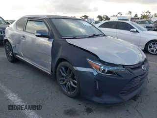 2014 Scion tC with VIN JTKJF5C79E3073875, listed as a IAAI auction lot 41536021 with 158,154 mi miles. Bid and sale history available at carsss.com. Image 1.