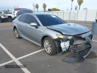 2019 Toyota Camry LE with VIN 4T1B11HK7KU803624, listed as a IAAI auction lot 41589107 with 169,863 mi miles and . Bid and sale history available at DreamBid. Image 1.