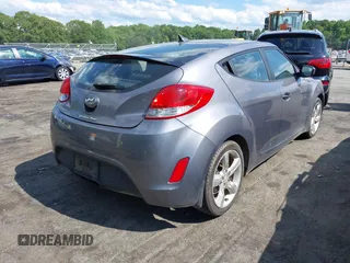 2013 Hyundai Veloster w/Gray Int with VIN KMHTC6ADXDU172104, listed as a IAAI auction lot 42198689 with 67,160 mi miles and . Bid and sale history available at DreamBid. Image 4.