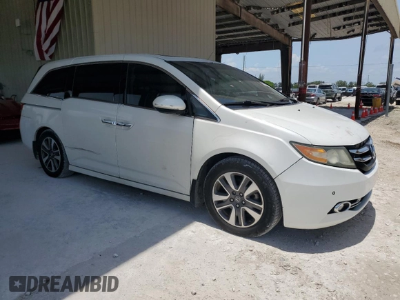 2014 Honda Odyssey Touring z VIN 5FNRL5H9XEB123330, wystawiony jako Copart lot #59023145 z przebiegiem 118 371 mil mil oraz Nie do naprawy • Non repairable. Historia ofert i sprzedaży dostępna na DreamBid. Obrazek 4.