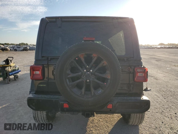 2021 Jeep Wrangler Unlimited Sahara High Altitude with VIN 1C4HJXEM0MW669053, listed as a Copart auction lot 77032134 with 41,133 mi miles and Salvage title. Bid and sale history available at DreamBid. Image 6.