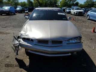 1998 Pontiac Bonneville SE z VIN 1G2HX52K0W4238012, wystawiony jako Copart lot #70997824 z przebiegiem 146 825 mil mil oraz Szkody całkowita. Historia ofert i sprzedaży dostępna na DreamBid. Obrazek 5.